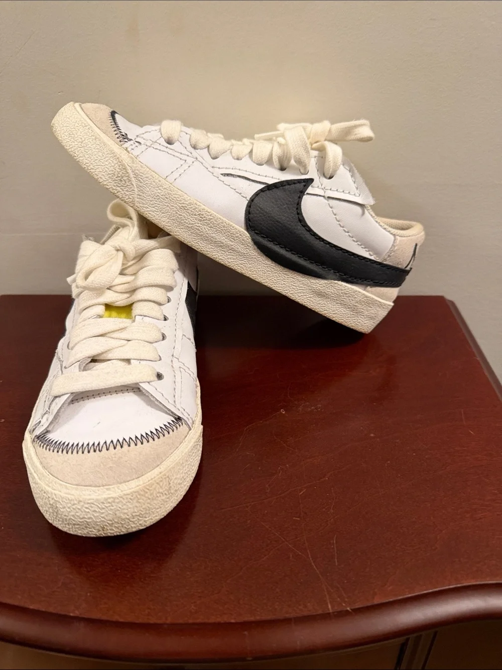 Nike White Sneakers with Black Swoosh and Cream Sole